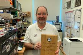 Professor Russ Congalton holding up his AmericaView Lifetime Achievement Award